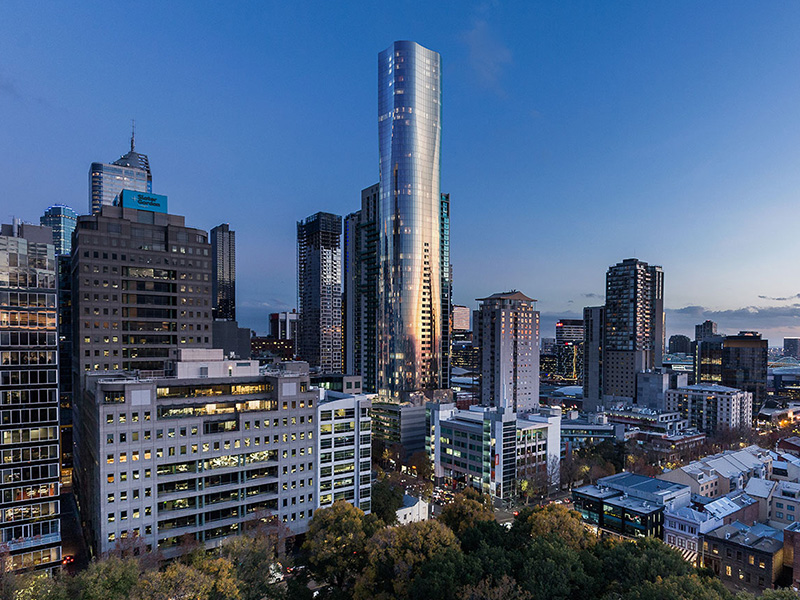 Aspire Melbourne building in dusk over Flagstaff Gardens